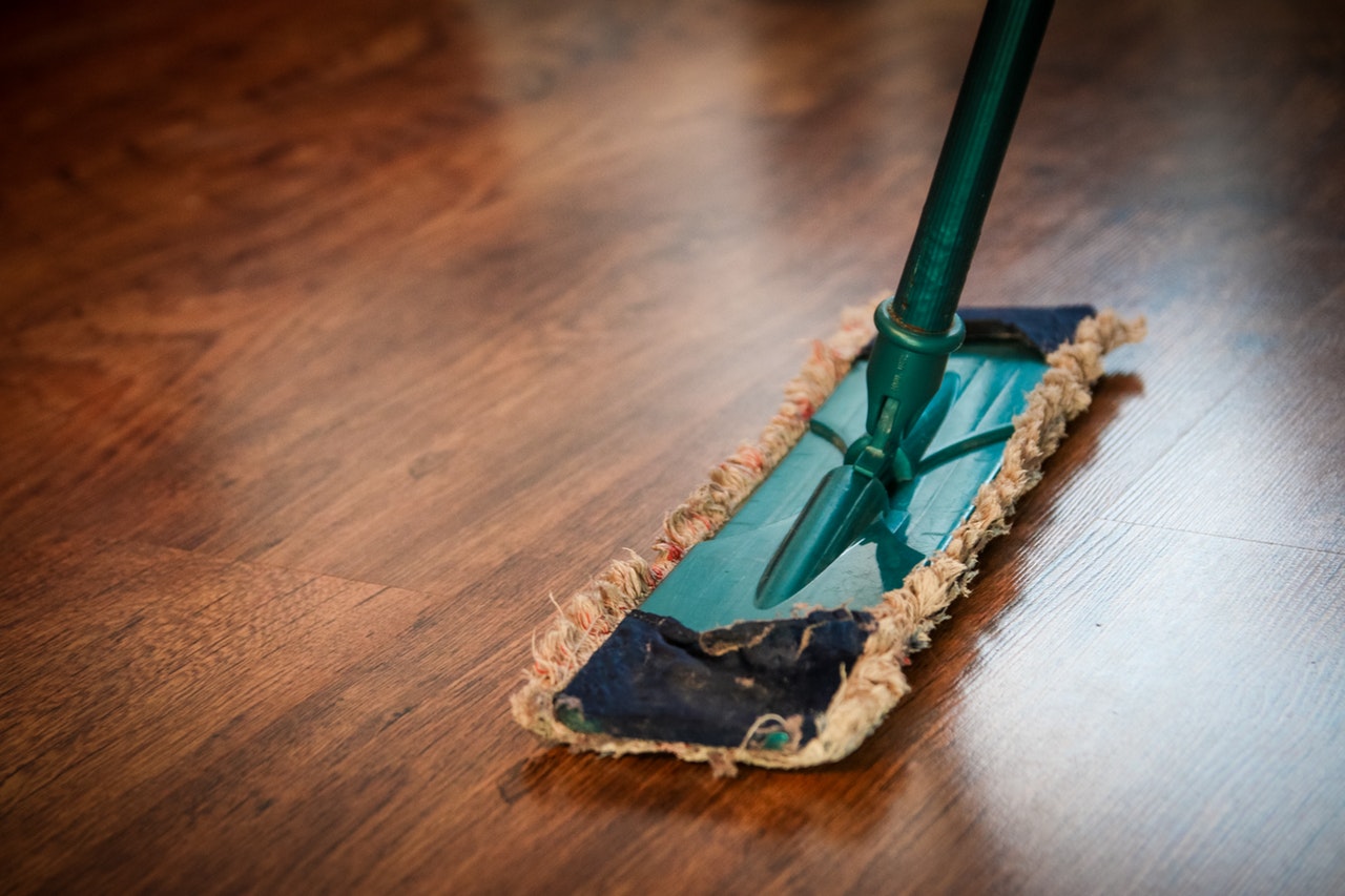 a mop stick on the wooden floor